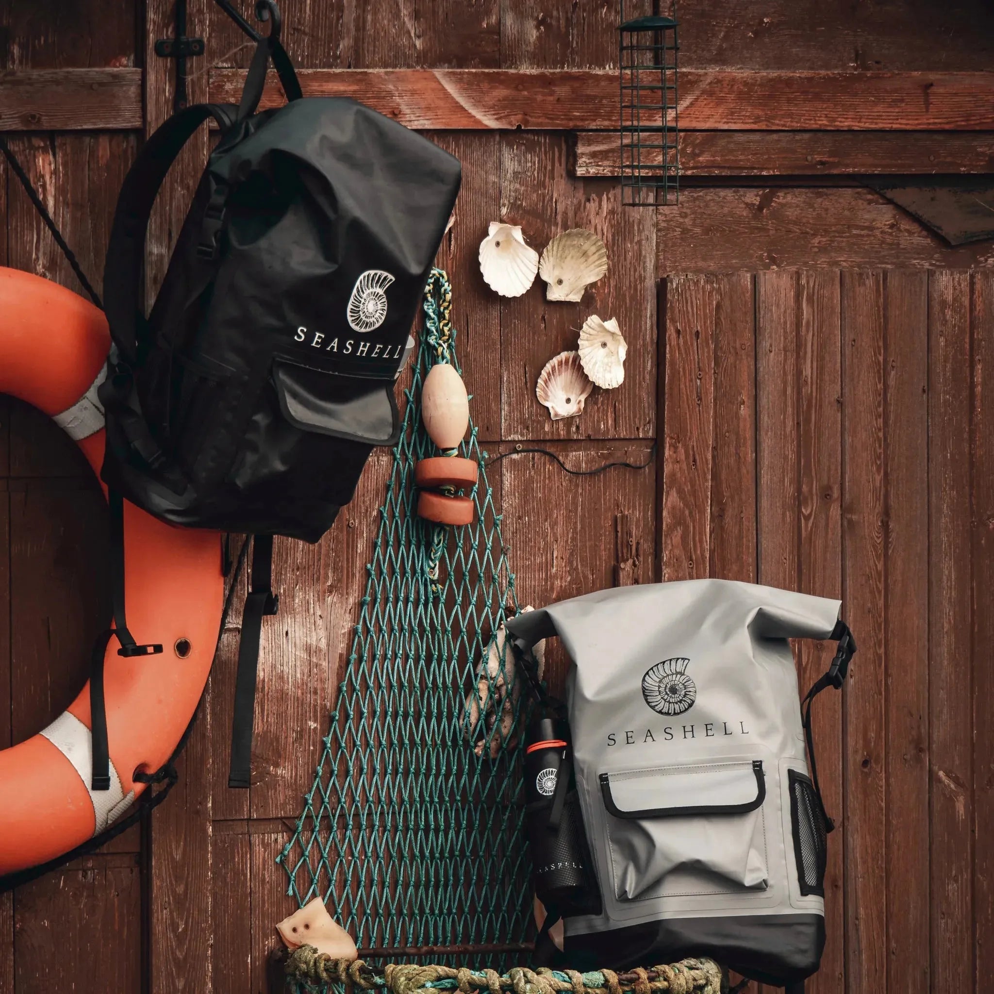 Seashell Drybag Backpacks in stone and black