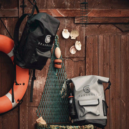 Seashell Drybag Backpacks in stone and black