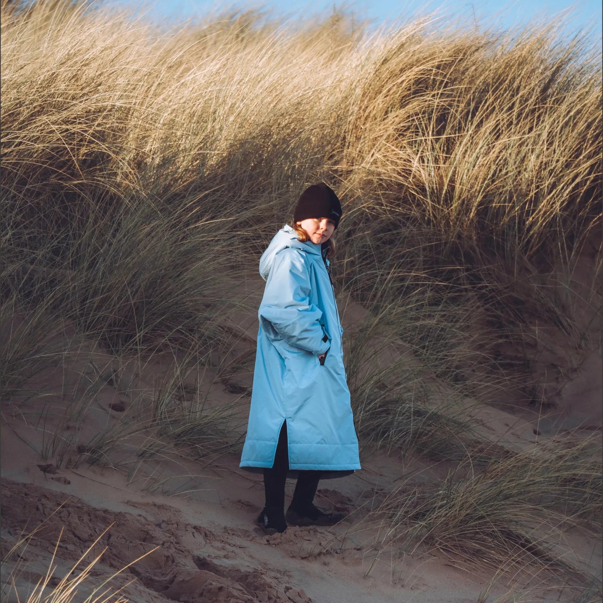 Kids Seashell changing robe in ocean, being worn at the beach